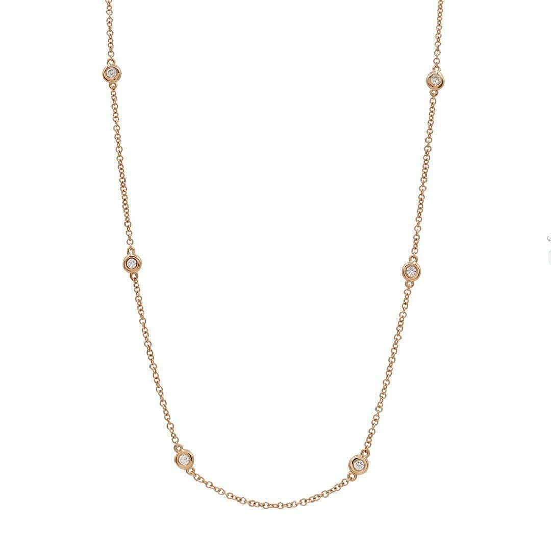 14 Karat Rose Gold & 10 Bezel Set Diamond Necklace Weighing 0.19 Carats.