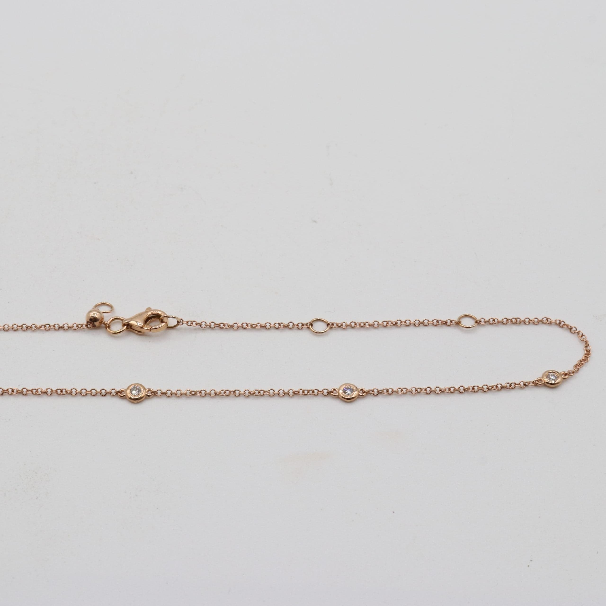 14 Karat Rose Gold & 10 Bezel Set Diamond Necklace Weighing 0.19 Carats. thumbnail 3