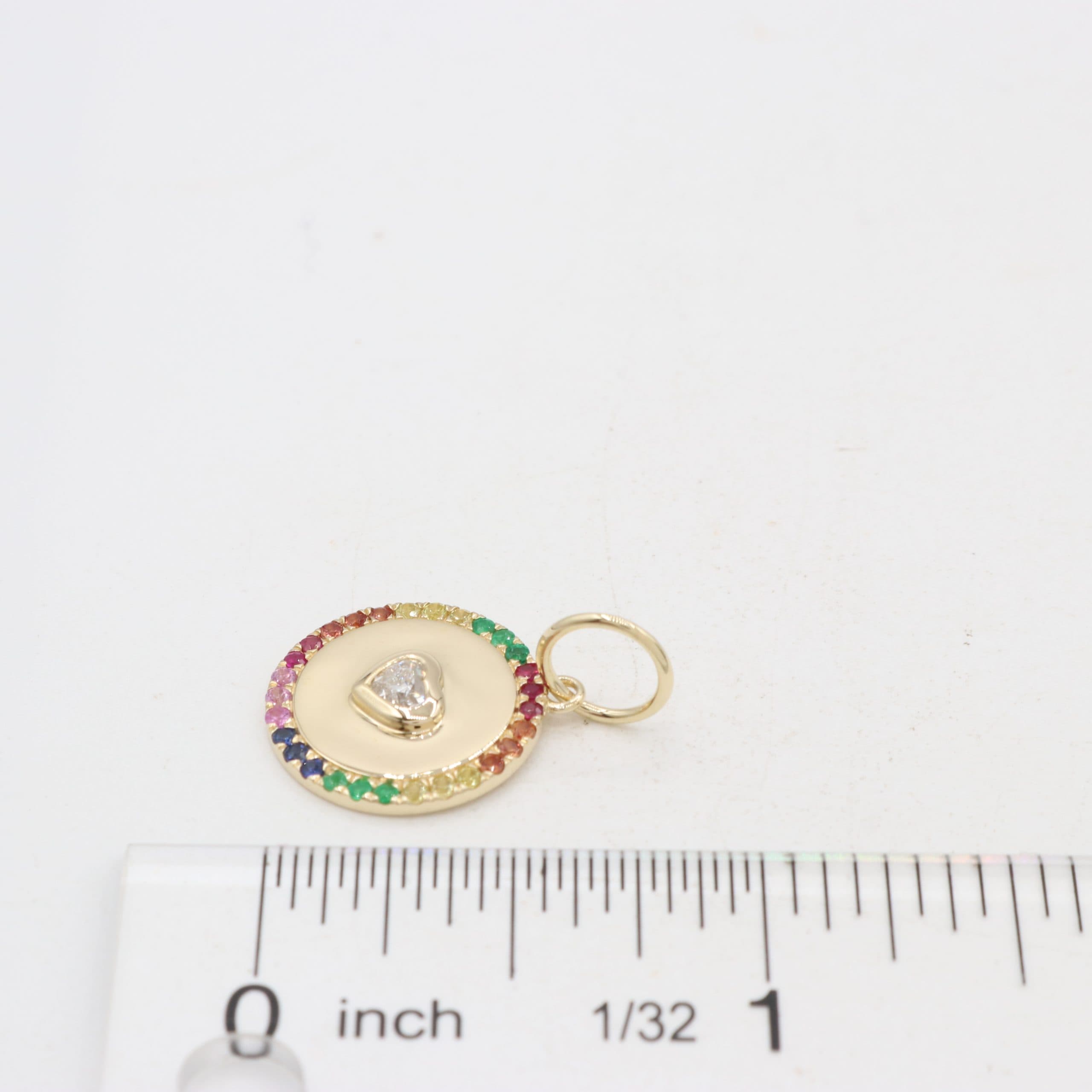 14 Karat Yellow Gold, Disc Pendant Containing 1 Heart Shaped Diamond Weighing 0.18 Carats, 5 Round Cut Rubies Weighing 0.06 Carats, 6 Round Cut Emeralds Weighing 0.06 Carats & 18 Round Cut Multicolored Sapphires Weighing 0.26 Carats. thumbnail 2